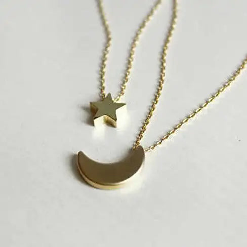 Golden Moon and Star Charms on a Layered Chain Necklace